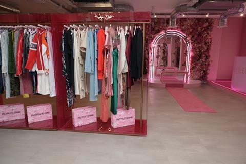 Interior of PrettyLittleThing, London, showing clothes on display